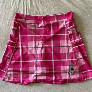 Hot pink plaid running skirt with built-in biker shorts and side Velcro pockets